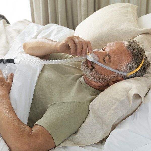 Man Sleeping with Solo CPAP Mask